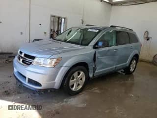 2013 Dodge Journey American Value with VIN 3C4PDCAB8DT576108, listed as a Copart auction lot 86882775 with 157,972 mi miles and Salvage title. Bid and sale history available at DreamBid. Image 1.
