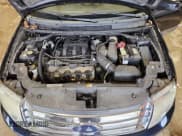 ✅ 2009 Ford Taurus X SEL • VIN: 1FMDK02WX9GA03971 • Lot: 86678015. Listed on Copart with 214,728 mi. Free auction sales archive from the USA and detailed vehicle history report at DreamBid. Image 12.