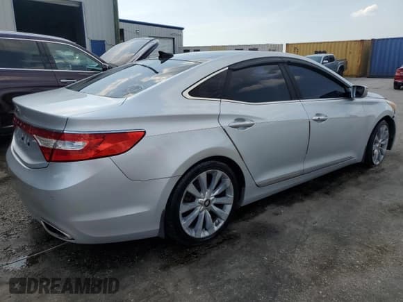 ✅ 2013 Hyundai Azera • VIN: KMHFH4JG8DA213103 • Лот: 57781955. Опубликован ранее на Copart с пробегом 173 515 миль. Бесплатный доступ к архиву аукционных продаж из США и подробный отчёт об истории автомобиля на DreamBid. Изображение 3.