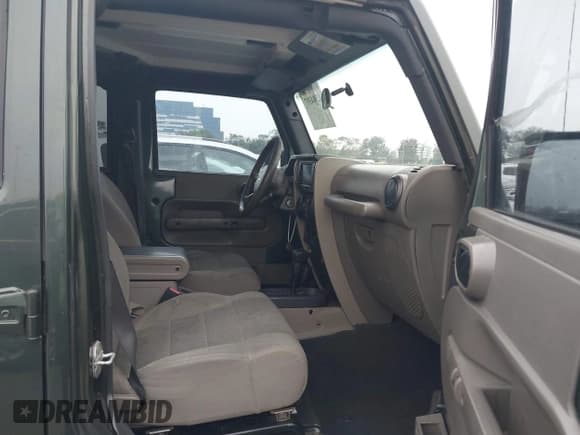 ✅ 2007 Jeep Wrangler Unlimited Sahara • VIN: 1J4GA59147L218594 • Lot: 42984397. Listed on IAAI with 108,296 mi. Free auction sales archive from the USA and detailed vehicle history report at DreamBid. Image 5.