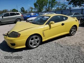 2006 Hyundai Tiburon GT с VIN KMHHN65F96U203308, выставлен на аукционе Copart как лот 47278684 с пробегом 186 123 миль миль и Списание • Salvage title. История ставок и продаж доступна на DreamBid. Изображение 1.