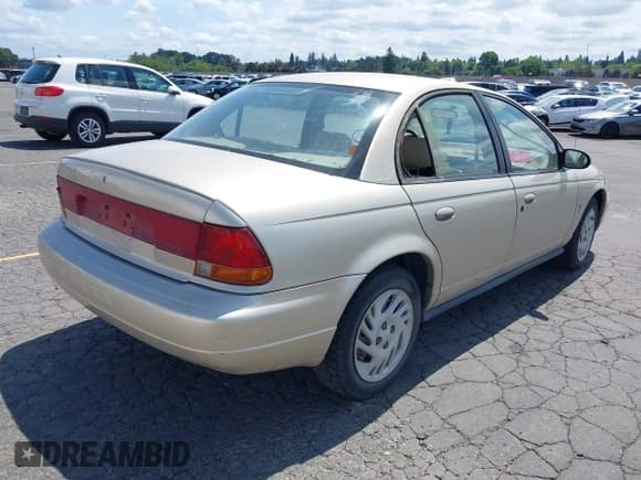 ✅ 1999 Saturn SL • VIN: 1G8ZK5275XZ283178 • Lot: 42303549. Wystawiony na IAAI z przebiegiem 216 776 mil. Bezpłatny archiwum sprzedaży aukcyjnych z USA i szczegółowy raport historii pojazdu na DreamBid. Zdjęcie 4.
