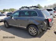 ✅ 2013 Volkswagen Touareg Exec • VIN: WVGEF9BP2DD000126 • Lot: 54430375. Listed on Copart with 111,677 mi. Free auction sales archive from the USA and detailed vehicle history report at DreamBid. Image 2.