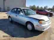 2004 Hyundai Accent GL z VIN KMHCG45C14U537604, wystawiony jako Copart lot #55402905 z przebiegiem 116 608 mil mil oraz Szkoda całkowita • Salvage title. Historia ofert i sprzedaży dostępna na DreamBid. Obrazek 4.