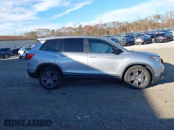 ✅ 2021 Honda Passport EX-L • VIN: 5FNYF8H51MB014349 • Lot: 43733895. Listed on IAAI with 36,679 mi. Free auction sales archive from the USA and detailed vehicle history report at DreamBid. Image 13.