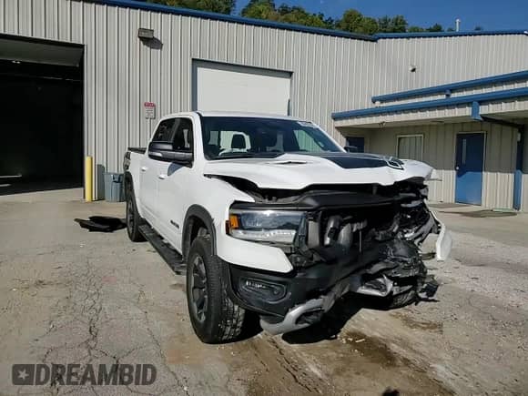 2020 Ram 1500 Rebel z VIN 1C6SRFLT4LN211966, wystawiony jako Copart lot #80487845 z przebiegiem 97 530 mil mil oraz Szkoda całkowita • Salvage title. Historia ofert i sprzedaży dostępna na DreamBid. Obrazek 14.