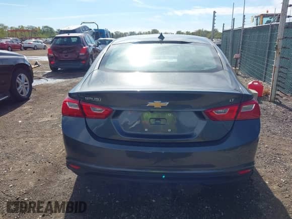 2018 Chevrolet Malibu LT z VIN 1G1ZD5ST7JF166538, wystawiony jako IAAI lot #43454660 z przebiegiem 46 901 mil mil oraz . Historia ofert i sprzedaży dostępna na DreamBid. Obrazek 16.