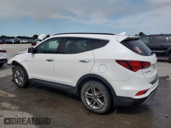 ✅ 2018 Hyundai Santa Fe 2.4L • VIN: 5NMZUDLB6JH102971 • Лот: 56756224. Опубликован ранее на Copart с пробегом 105 836 миль. Бесплатный доступ к архиву аукционных продаж из США и подробный отчёт об истории автомобиля на DreamBid. Изображение 2.