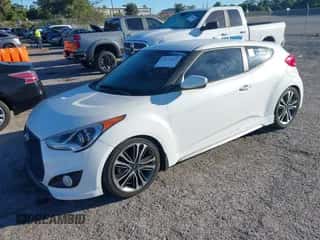 2016 Hyundai Veloster Turbo z VIN KMHTC6AE8GU273333, wystawiony jako IAAI lot #43472469 z przebiegiem 111 089 mil mil oraz . Historia ofert i sprzedaży dostępna na DreamBid. Obrazek 2.