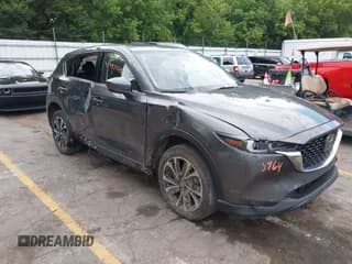 ✅ 2023 Mazda CX-5 S Premium Plus • VIN: JM3KFBEM8P0144895 • Lot: 42993964. Listed on IAAI with 32,604 mi. Free auction sales archive from the USA and detailed vehicle history report at DreamBid. Image 1.