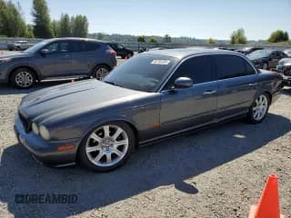 ✅ 2005 Jaguar XJ 8 LWB • VIN: SAJWA79C65SG47970 • Лот: 66758195. Опубликован ранее на Copart с пробегом 145 066 миль. Бесплатный доступ к архиву аукционных продаж из США и подробный отчёт об истории автомобиля на DreamBid. Изображение 1.