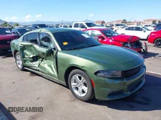 ✅ 2022 Dodge Charger SXT • VIN: 2C3CDXBG1NH138867 • Lot: 43454424. Listed on IAAI with 39,320 mi. Free auction sales archive from the USA and detailed vehicle history report at DreamBid. Image 1.