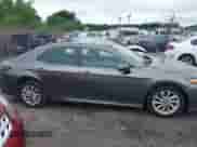 2021 Toyota Camry LE with VIN 4T1C11BK5MU028031, listed as a IAAI auction lot 42502600 with 115,138 mi miles and . Bid and sale history available at DreamBid. Image 14.