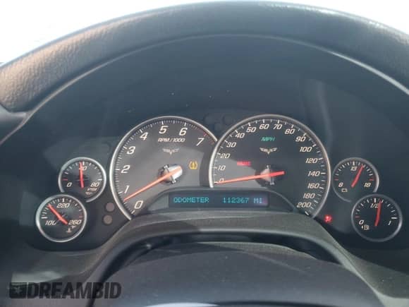 2006 Chevrolet Corvette with VIN 1G1YY26U165123036, listed as a Copart auction lot 82493634 with 112,367 mi miles and Salvage title. Bid and sale history available at DreamBid. Image 9.