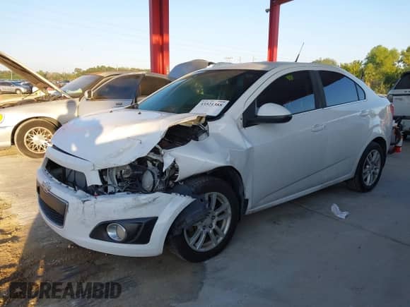 2014 Chevrolet Sonic LT with VIN 1G1JC5SG9E4127762, listed as a IAAI auction lot 43521388 with 128,333 mi miles and . Bid and sale history available at DreamBid. Image 2.