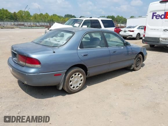 ✅ 1997 Mazda 626 DX • VIN: 1YVGE22CXV5664944 • Lot: 43037583. Listed on IAAI with 273,792 mi. Free auction sales archive from the USA and detailed vehicle history report at DreamBid. Image 4.