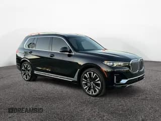 ✅ 2019 BMW X7 xDrive50i • VIN: 5UXCX4C58KLS38928 • Лот: 93027945. Опубликован ранее на Copart с пробегом 98 606 миль. Бесплатный доступ к архиву аукционных продаж из США и подробный отчёт об истории автомобиля на DreamBid. Изображение 1.