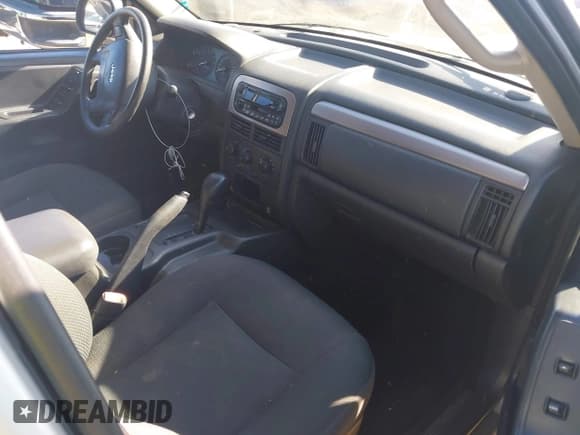 ✅ 2004 Jeep Grand Cherokee Laredo • VIN: 1J4GX48S14C232077 • Lot: 43911088. Listed on IAAI with 117,825 mi. Free auction sales archive from the USA and detailed vehicle history report at DreamBid. Image 5.