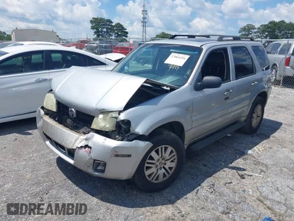 2005 Mercury Mariner Luxury z VIN 4M2YU561X5DJ09502, wystawiony jako IAAI lot #37069354 z przebiegiem Nie podano mil oraz . Historia ofert i sprzedaży dostępna na DreamBid. Obrazek 17.