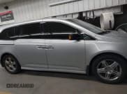 ✅ 2012 Honda Odyssey Touring • VIN: 5FNRL5H90CB004537 • Lot: 43184321. Listed on IAAI with 132,469 mi. Free auction sales archive from the USA and detailed vehicle history report at DreamBid. Image 13.