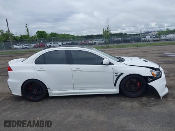 ✅ 2013 Mitsubishi Lancer Evolution GSR • VIN: JA32W8FV0DU023509 • Lot: 42222552. Wystawiony na IAAI z przebiegiem 128 030 mil. Bezpłatny archiwum sprzedaży aukcyjnych z USA i szczegółowy raport historii pojazdu na DreamBid. Zdjęcie 13.