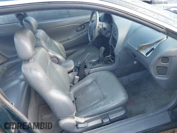 1995 Dodge Avenger z VIN 4B3AU52N9SE215767, wystawiony jako IAAI lot #43494144 z przebiegiem 217 304 mil mil oraz . Historia ofert i sprzedaży dostępna na DreamBid. Obrazek 5.