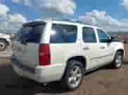 2013 Chevrolet Tahoe LTZ with VIN 1GNSCCE09DR357731, listed as a IAAI auction lot 43343449 with 148,667 mi miles and . Bid and sale history available at DreamBid. Image 4.