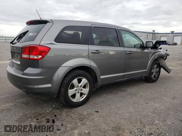 2012 Dodge Journey American Value z VIN 3C4PDCAB4CT146025, wystawiony jako Copart lot #81183785 z przebiegiem 166 921 mil mil oraz Szkoda całkowita • Salvage title. Historia ofert i sprzedaży dostępna na DreamBid. Obrazek 3.