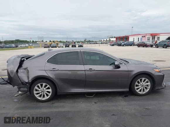 2022 Toyota Camry LE with VIN 4T1C11AK0NU653830, listed as a IAAI auction lot 43428154 with 21,960 mi miles and . Bid and sale history available at DreamBid. Image 14.