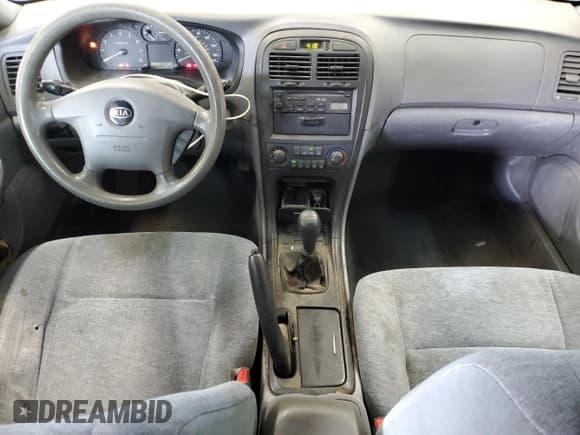 ✅ 2003 Kia Optima LX • VIN: KNAGD126835231470 • Лот: 81158395. Опубликован ранее на Copart с пробегом 126 172 миль. Бесплатный доступ к архиву аукционных продаж из США и подробный отчёт об истории автомобиля на DreamBid. Изображение 8.