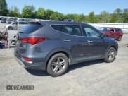 ✅ 2018 Hyundai Santa Fe 2.4L • VIN: 5XYZTDLBXJG563426 • Лот: 68144014. Опубликован ранее на Copart с пробегом 96 666 миль. Бесплатный доступ к архиву аукционных продаж из США и подробный отчёт об истории автомобиля на DreamBid. Изображение 3.