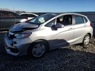 ✅ 2018 Honda Fit LX • VIN: 3HGGK5G46JM703892 • Лот: 79742984. Опубликован ранее на Copart с пробегом 67 825 миль. Бесплатный доступ к архиву аукционных продаж из США и подробный отчёт об истории автомобиля на DreamBid. Изображение 1.