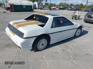 ✅ 1986 Pontiac Fiero • VIN: 1G2PF3797GP269850 • Лот: 40722755. Опубликован ранее на IAAI с пробегом 129 077 миль. Бесплатный доступ к архиву аукционных продаж из США и подробный отчёт об истории автомобиля на DreamBid. Изображение 4.