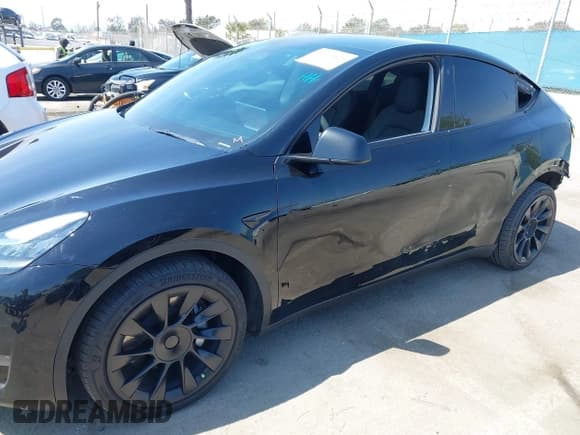 ✅ 2023 Tesla Model Y Long Range • VIN: 7SAYGDEE0PA023719 • Lot: 41974415. Listed on IAAI with 50,152 mi. Free auction sales archive from the USA and detailed vehicle history report at DreamBid. Image 21.