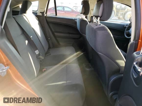 2011 Dodge Caliber Mainstreet с VIN 1B3CB3HA7BD296055, выставлен на аукционе Copart как лот 77326684 с пробегом 158 123 миль миль и На запчасти • Non repairable. История ставок и продаж доступна на DreamBid. Изображение 10.