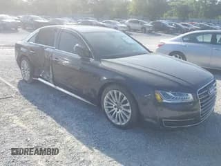 ✅ 2015 Audi A8 4.0T • VIN: WAU32AFD9FN019551 • Lot: 42658653. Wystawiony na IAAI z przebiegiem 101 033 mil. Bezpłatny archiwum sprzedaży aukcyjnych z USA i szczegółowy raport historii pojazdu na DreamBid. Zdjęcie 1.