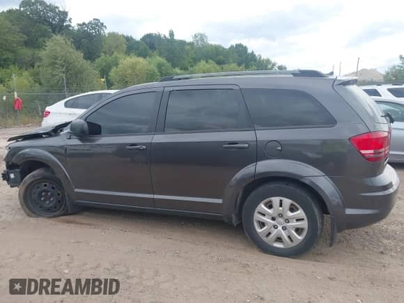 2017 Dodge Journey SE with VIN 3C4PDCAB2HT636910, listed as a IAAI auction lot 43095502 with 173,852 mi miles and . Bid and sale history available at DreamBid. Image 14.