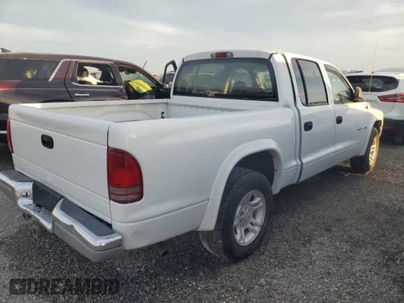 2002 Dodge Dakota SLT with VIN 1B7HL48X02S651073, listed as a Copart auction lot 74731254 with 93,064 mi miles and Non repairable. Bid and sale history available at DreamBid. Image 3.