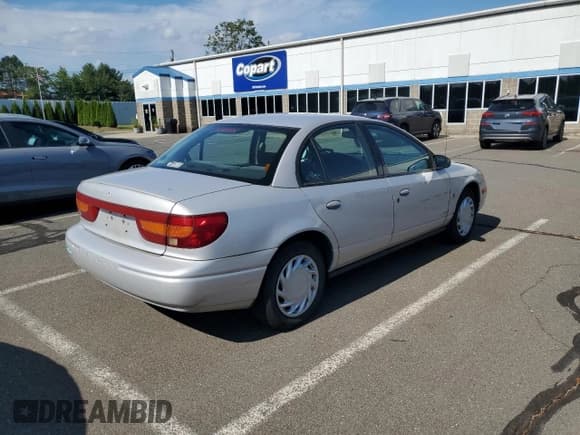 ✅ 2000 Saturn SL • VIN: 1G8ZK5279YZ252761 • Lot: 63204475. Listed on Copart with 80,646 mi. Free auction sales archive from the USA and detailed vehicle history report at DreamBid. Image 3.
