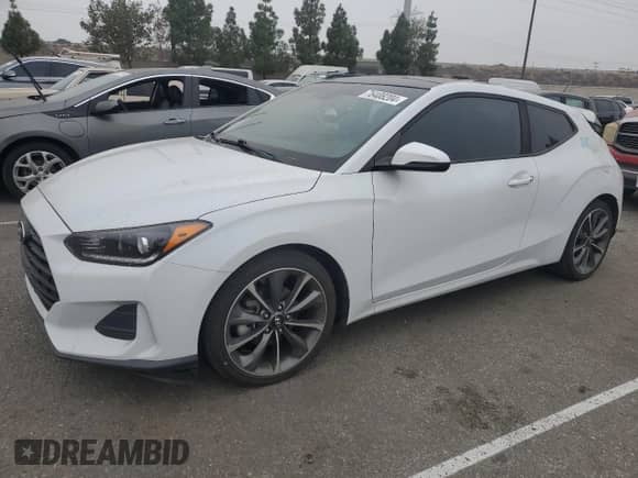 2020 Hyundai Veloster 2.0 z VIN KMHTG6AF6LU027629, wystawiony jako Copart lot #76408204 z przebiegiem 74 849 mil mil oraz Szkoda całkowita • Salvage title. Historia ofert i sprzedaży dostępna na DreamBid. Obrazek 1.