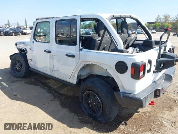 ✅ 2023 Jeep Wrangler Rubicon • VIN: 1C4HJXFG1PW600353 • Lot: 43338003. Listed on IAAI with 26,306 mi. Free auction sales archive from the USA and detailed vehicle history report at DreamBid. Image 3.