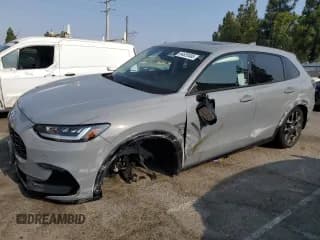 ✅ 2026 Honda HR-V EX-L • VIN: 3CZRZ1H77TM704115 • Лот: 64620495. Опубликован ранее на Copart с пробегом 1 285 миль. Бесплатный доступ к архиву аукционных продаж из США и подробный отчёт об истории автомобиля на DreamBid. Изображение 1.