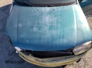 ✅ 1996 Mazda Protege DX • VIN: JM1BB1417T0332534 • Lot: 87264895. Wystawiony na Copart z przebiegiem 178 862 mil. Bezpłatny archiwum sprzedaży aukcyjnych z USA i szczegółowy raport historii pojazdu na DreamBid. Zdjęcie 11.