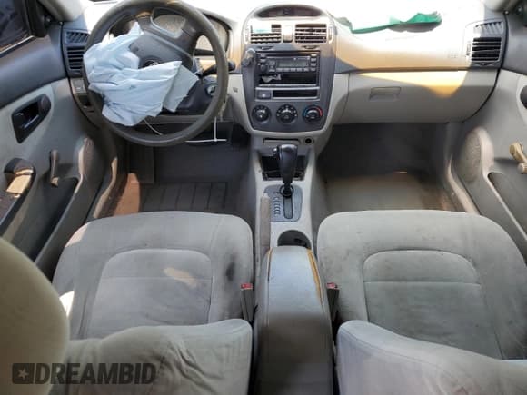 ✅ 2004 Kia Spectra LX • VIN: KNAFE121045015286 • Lot: 62996985. Wystawiony na Copart z przebiegiem 108 026 mil. Bezpłatny archiwum sprzedaży aukcyjnych z USA i szczegółowy raport historii pojazdu na DreamBid. Zdjęcie 8.