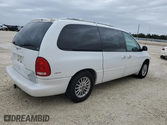 ✅ 1999 Chrysler Town & Country LXi • VIN: 1C4GP64L2XB779000 • Lot: 75893594. Listed on Copart with 109,619 mi. Free auction sales archive from the USA and detailed vehicle history report at DreamBid. Image 3.