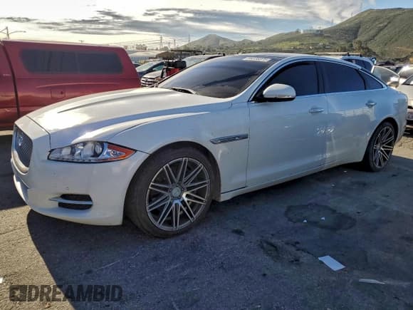 ✅ 2015 Jaguar XJ Portfolio • VIN: SAJWA2GZ8F8V86174 • Lot: 96338375. Listed on Copart with 94,741 mi. Free auction sales archive from the USA and detailed vehicle history report at DreamBid. Image 1.