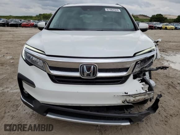 ✅ 2022 Honda Pilot Touring 7-Passenger • VIN: 5FNYF5H65NB030899 • Lot: 67962524. Listed on Copart with 34,124 mi. Free auction sales archive from the USA and detailed vehicle history report at DreamBid. Image 5.