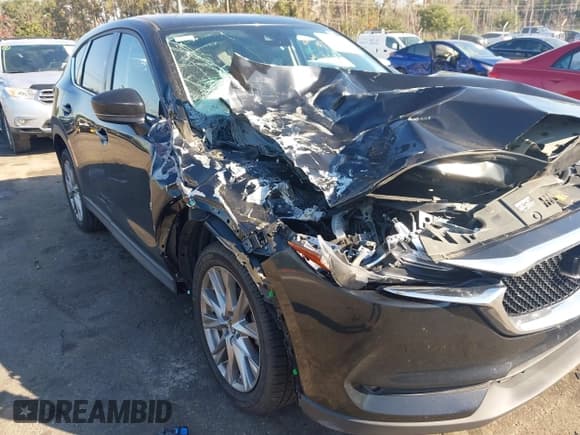 ✅ 2020 Mazda CX-5 Grand Touring • VIN: JM3KFADM9L0766623 • Lot: 43706056. Wystawiony na IAAI z przebiegiem 54 913 mil. Bezpłatny archiwum sprzedaży aukcyjnych z USA i szczegółowy raport historii pojazdu na DreamBid. Zdjęcie 6.