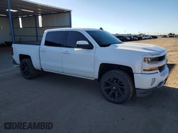 2017 Chevrolet Silverado 1500 LT with VIN 3GCUKREC0HG346639, listed as a Copart auction lot 84704735 with 155,893 mi miles and Salvage title. Bid and sale history available at DreamBid. Image 4.
