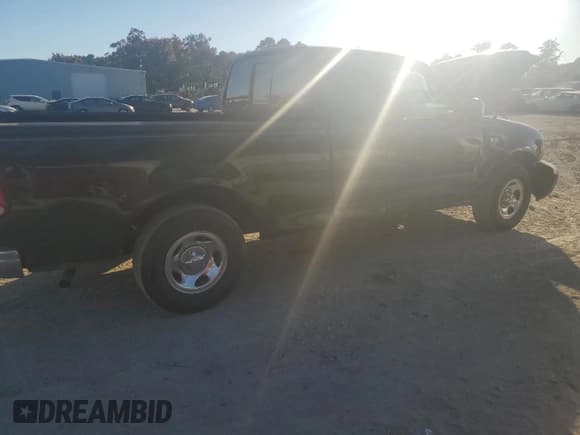 ✅ 2001 Ford F-150 • VIN: 2FTZX17221CA27274 • Lot: 77949204. Listed on Copart with Not provided. Free auction sales archive from the USA and detailed vehicle history report at DreamBid. Image 3.